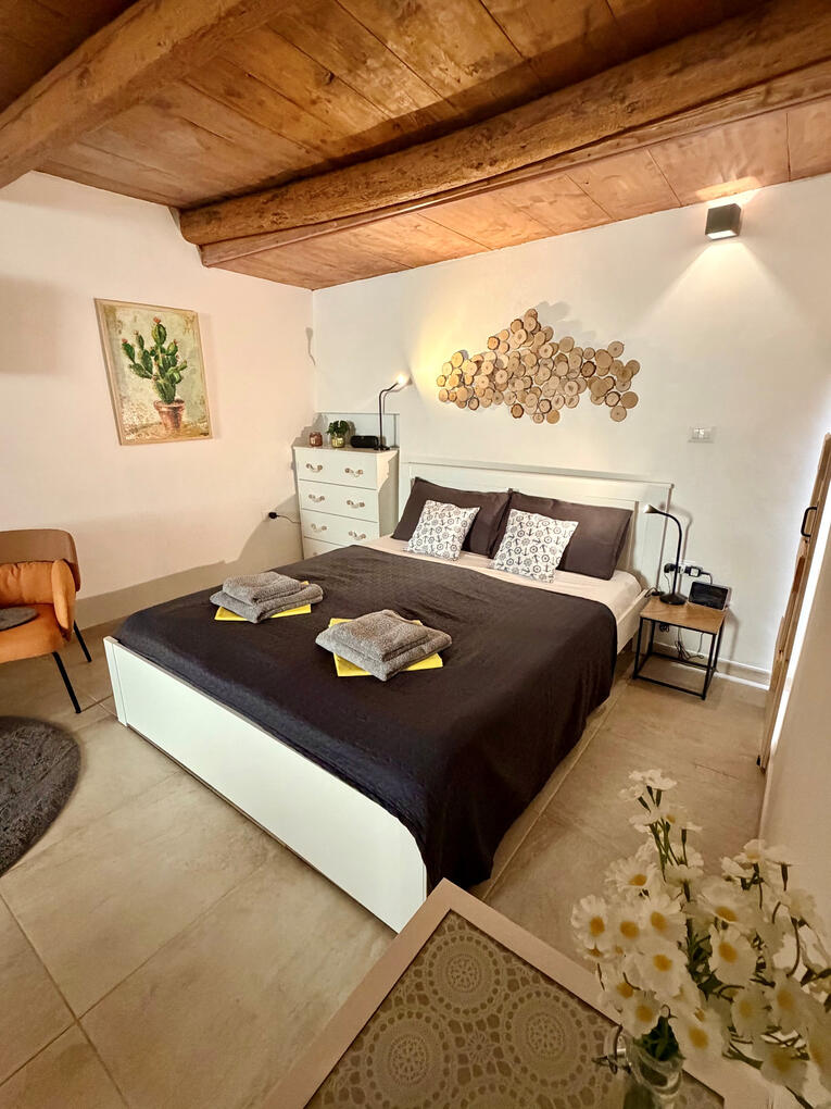 Bed Double bed at Casa Santa Barbara holiday apartment in Alghero